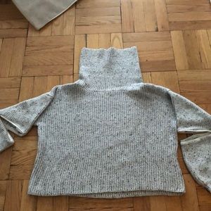 Cropped turtle neck with zippers at elbows